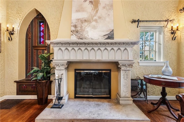 interior space with a fireplace and dark wood-type flooring