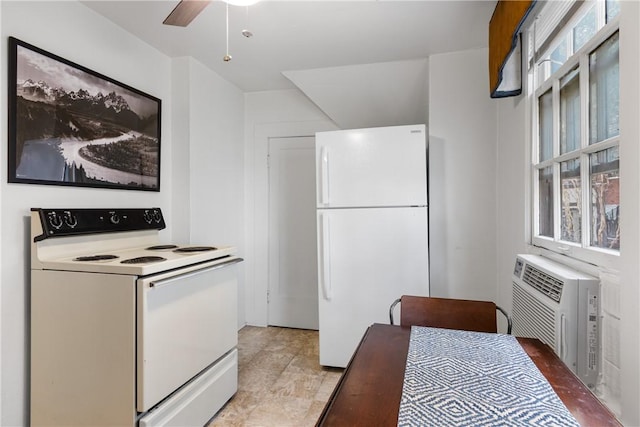 kitchen featuring ceiling fan, plenty of natural light, a wall mounted air conditioner, and white appliances