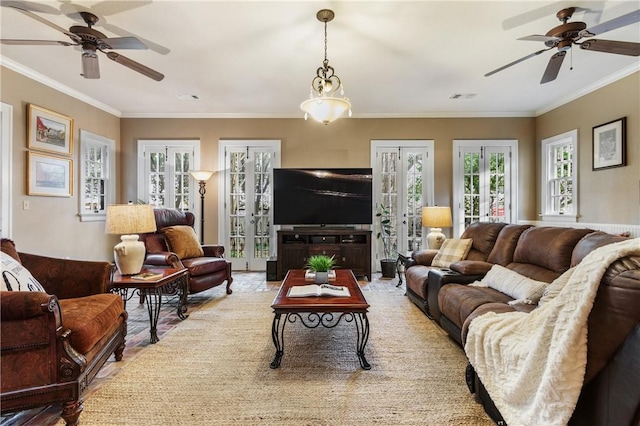 living room with crown molding and french doors