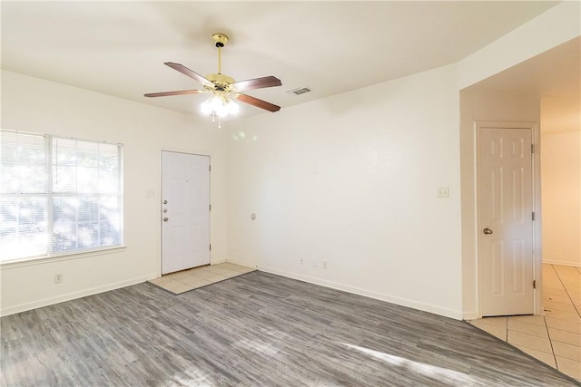 unfurnished room featuring ceiling fan and light hardwood / wood-style flooring