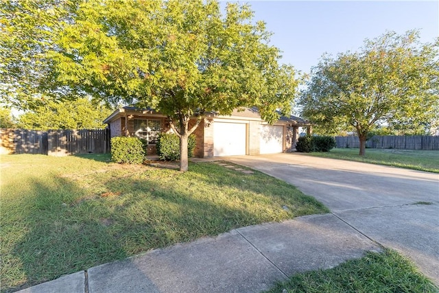 view of front facade featuring a front lawn and a garage