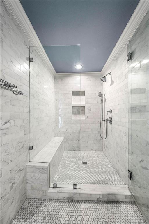 bathroom featuring tile patterned floors, crown molding, and walk in shower