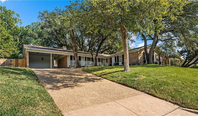 single story home with a front lawn and a carport