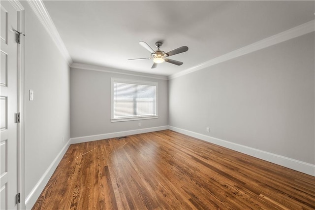 spare room featuring hardwood / wood-style floors, ceiling fan, and ornamental molding