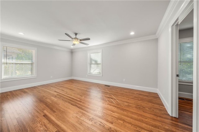 unfurnished room with wood-type flooring, ceiling fan, and crown molding