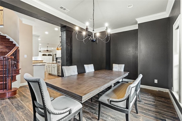 dining space featuring dark hardwood / wood-style flooring, ceiling fan with notable chandelier, and ornamental molding