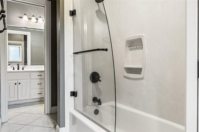 bathroom featuring tile patterned floors, vanity, and washtub / shower combination