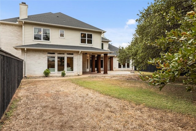 back of property featuring a patio