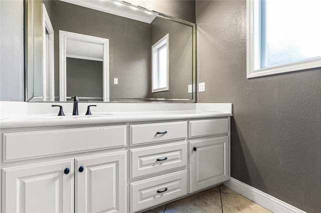 bathroom with tile patterned floors and vanity