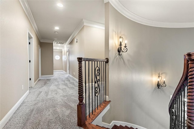 corridor featuring light colored carpet and ornamental molding