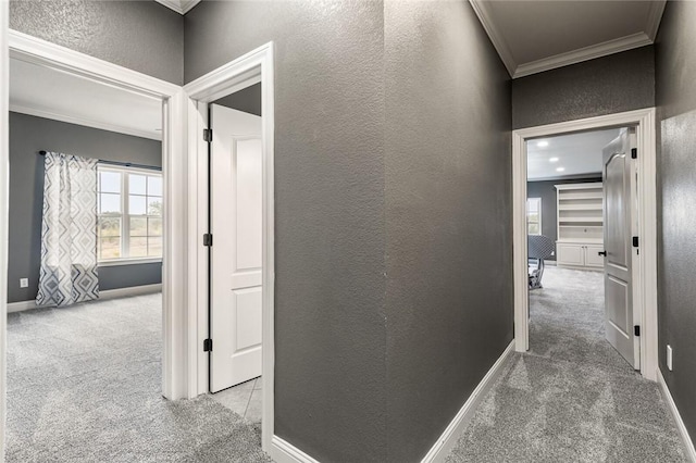 hall featuring light carpet and crown molding