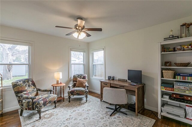 office space with ceiling fan, baseboards, and wood finished floors