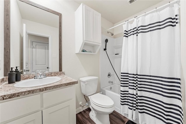 full bathroom featuring toilet, shower / bath combo, wood finished floors, and vanity