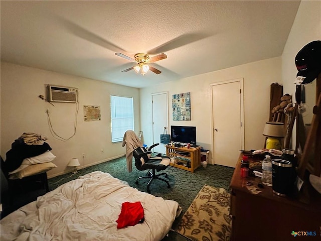 carpeted bedroom featuring a wall mounted air conditioner, a textured ceiling, and ceiling fan