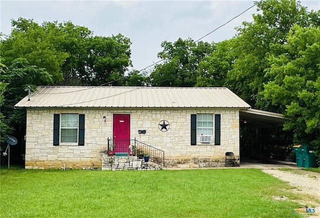 view of front facade with cooling unit, a carport, and a front lawn