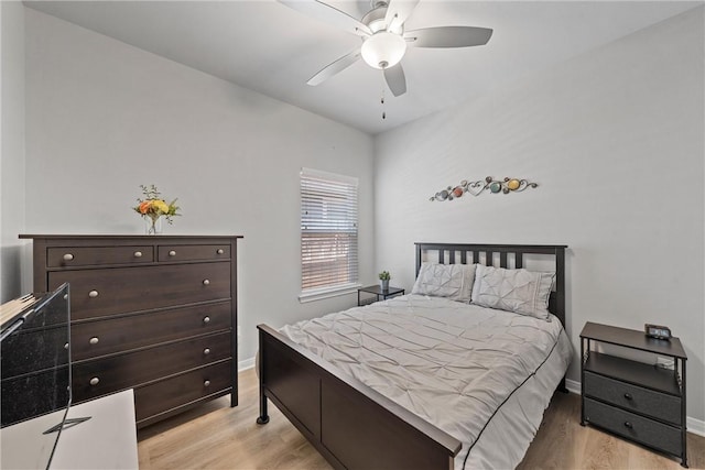 bedroom with ceiling fan and light hardwood / wood-style floors