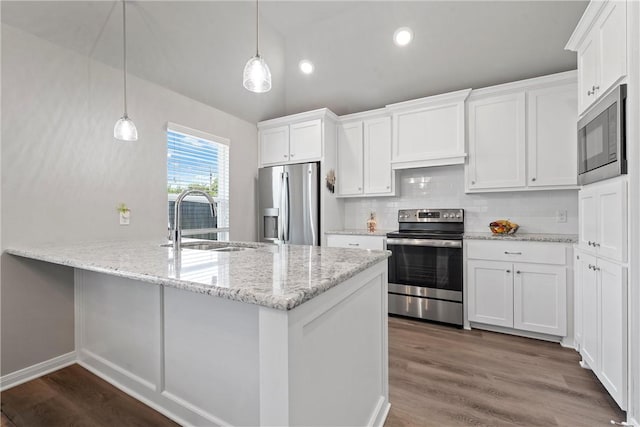 kitchen with white cabinetry, appliances with stainless steel finishes, sink, and pendant lighting