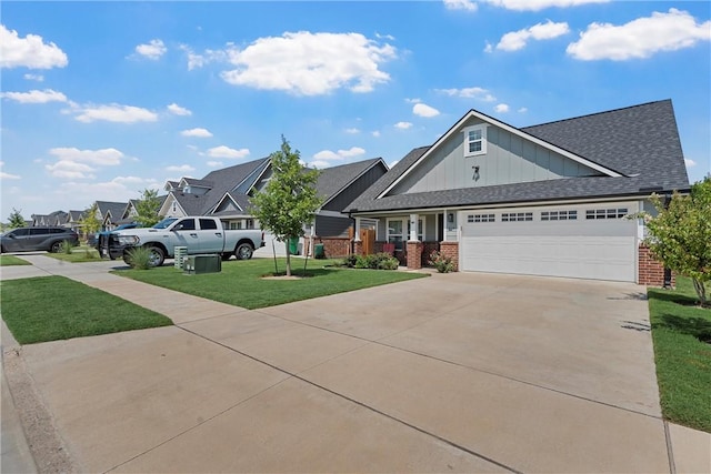 view of front of house featuring a garage and a front lawn