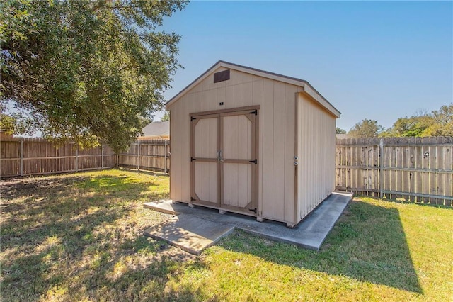 view of outbuilding with a yard