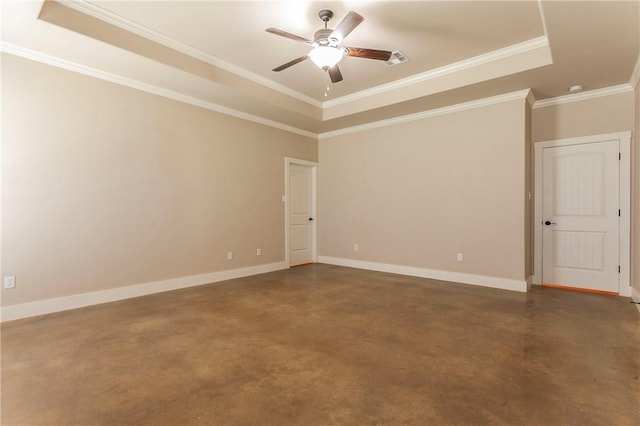 empty room with ceiling fan, a raised ceiling, and crown molding