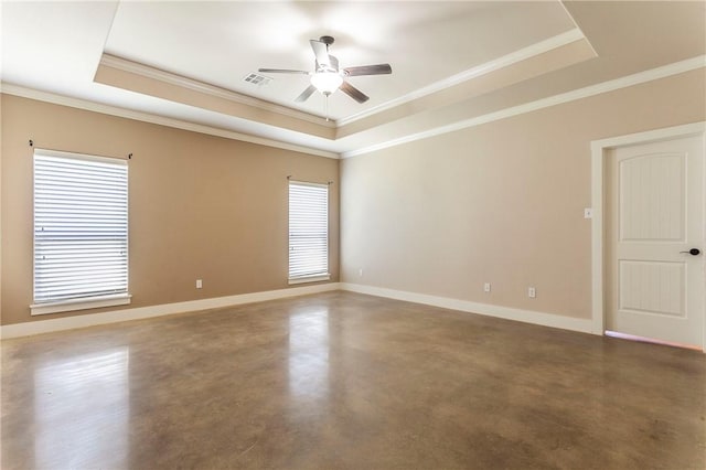 unfurnished room with a raised ceiling and ornamental molding