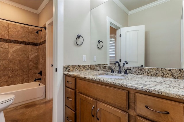 full bathroom featuring toilet, vanity, tiled shower / bath combo, and crown molding