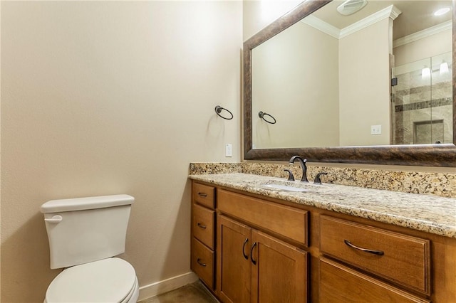 bathroom featuring vanity, toilet, an enclosed shower, and crown molding