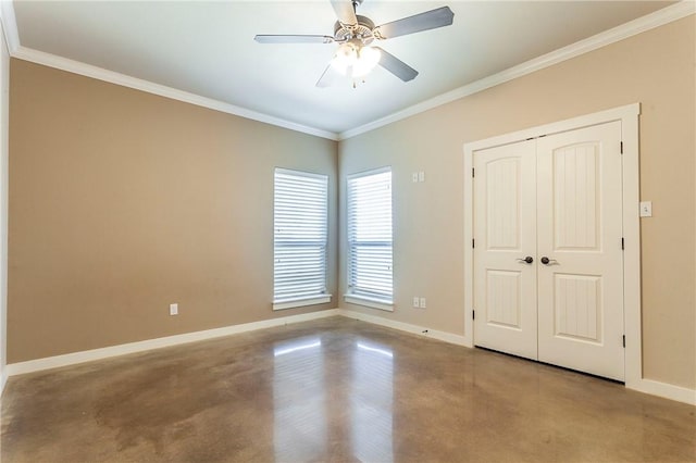 unfurnished bedroom featuring ceiling fan, crown molding, and a closet