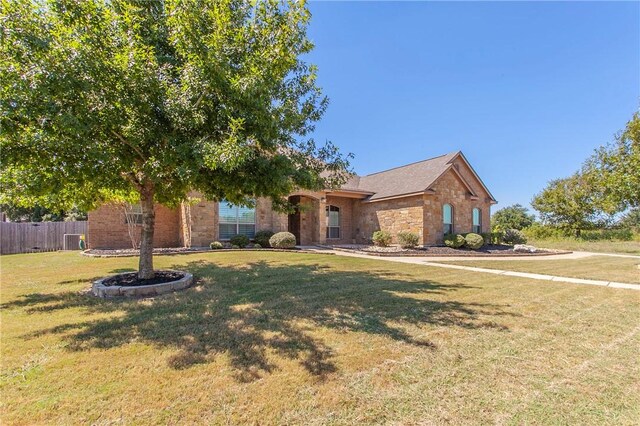 view of front of property with a front lawn