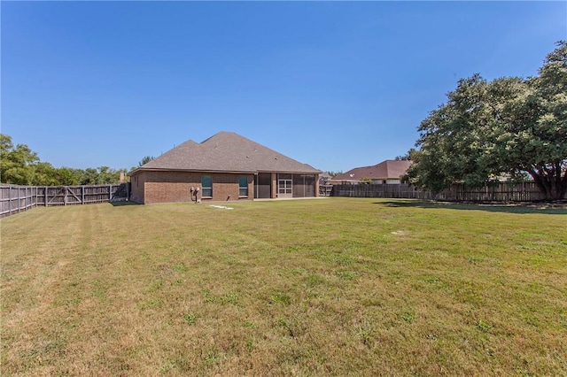 view of yard featuring a sunroom