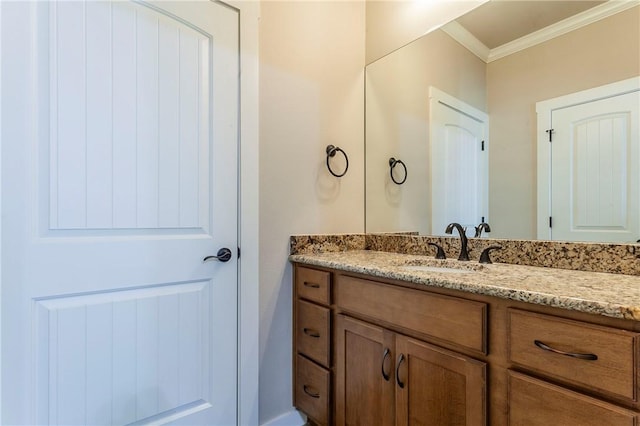 bathroom featuring vanity and crown molding