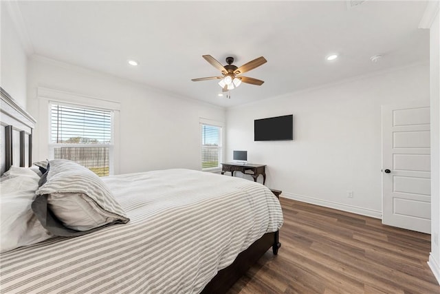 bedroom with a ceiling fan, wood finished floors, baseboards, recessed lighting, and ornamental molding