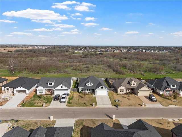 birds eye view of property with a residential view