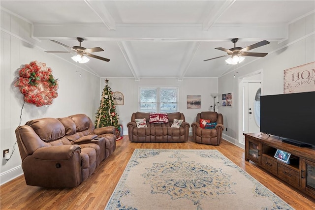 living room with beam ceiling, light hardwood / wood-style floors, and ceiling fan