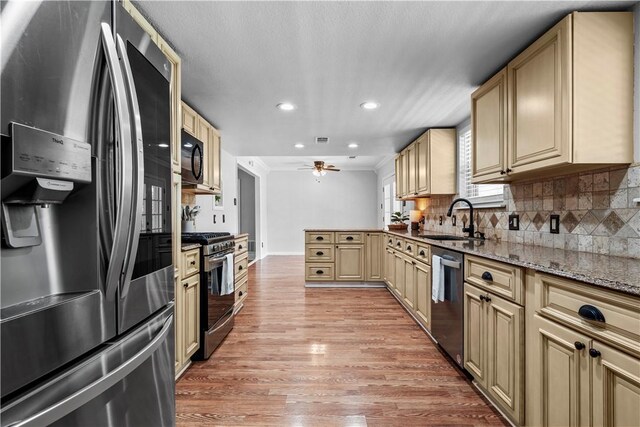 laundry area with separate washer and dryer and cabinets