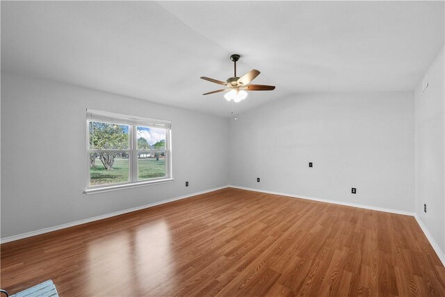 living room featuring carpet flooring, lofted ceiling with beams, and wooden walls