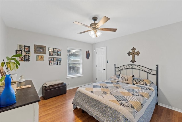 bedroom with wood-type flooring and ceiling fan