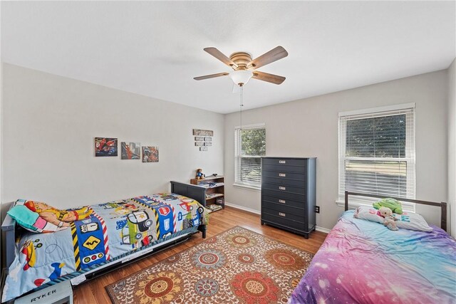 carpeted living room with vaulted ceiling with beams, wood walls, and ceiling fan