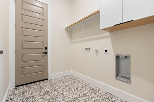 laundry room with hookup for an electric dryer and cabinets