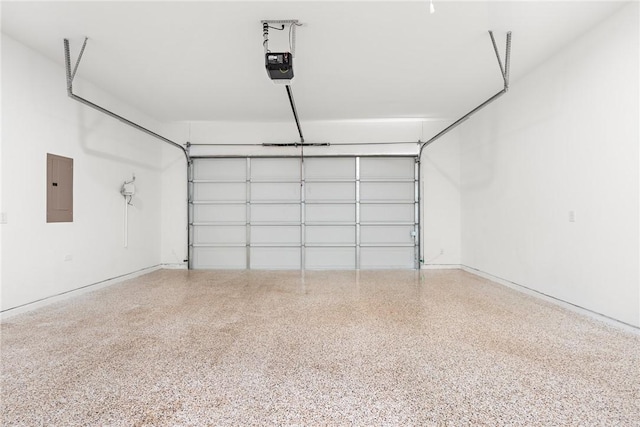 garage with electric panel and a garage door opener