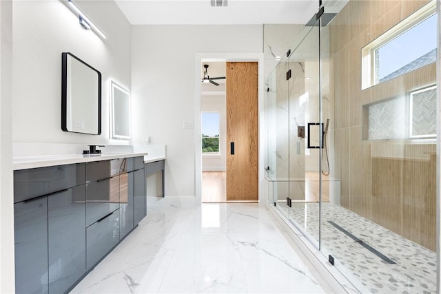 bathroom with walk in shower, vanity, plenty of natural light, and ceiling fan