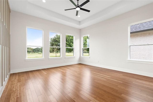 empty room featuring light wood-type flooring and ceiling fan