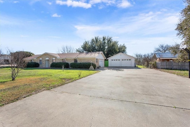 ranch-style house featuring a garage and a front yard