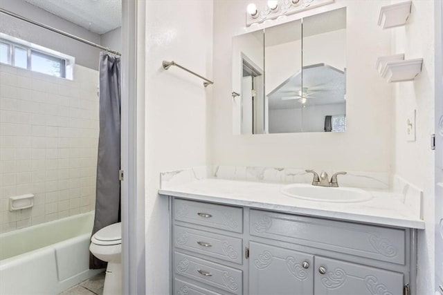 full bathroom featuring ceiling fan, shower / bath combo, a textured ceiling, toilet, and vanity