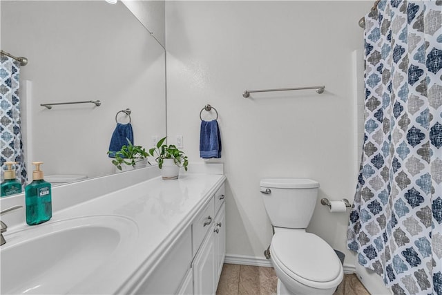 bathroom featuring tile patterned floors, vanity, toilet, and a shower with curtain