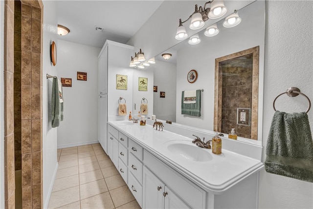 bathroom with tile patterned flooring and vanity