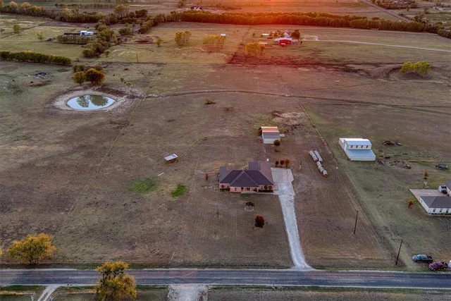 birds eye view of property featuring a rural view