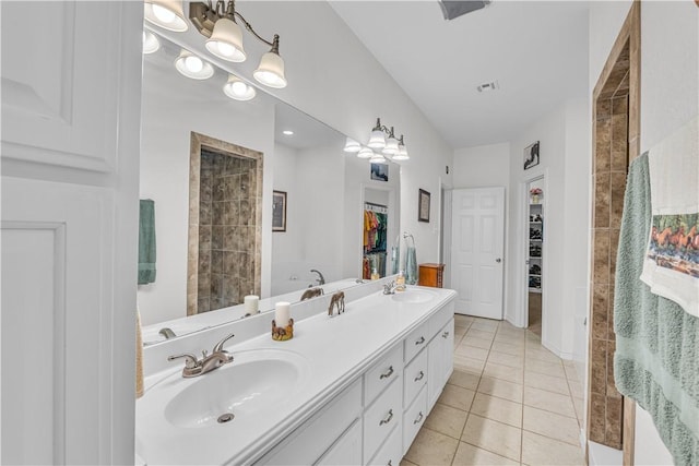 bathroom featuring tile patterned flooring and vanity