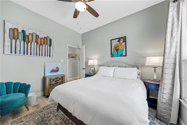 bedroom with hardwood / wood-style floors and ceiling fan