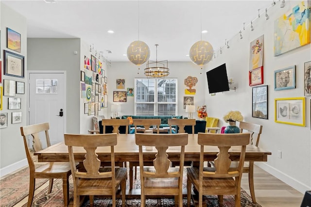 dining area with light hardwood / wood-style flooring